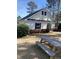 Exterior view of the community building with picnic tables surrounded by well-maintained landscaping at 745 Great Oak Pl, Villa Rica, GA 30180