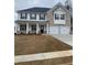Charming two-story home with a brick facade and a well-manicured front yard at 745 Great Oak Pl, Villa Rica, GA 30180