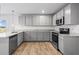 Bright kitchen featuring granite countertops and stainless steel appliances at 745 Great Oak Pl, Villa Rica, GA 30180