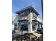 Exterior shot of a Moe's Southwest Grill with outdoor seating and easy access at 745 Great Oak Pl, Villa Rica, GA 30180