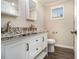 Elegant bathroom featuring a double sink vanity, granite countertops, modern fixtures, and ample storage space at 1961 S Columbia, Decatur, GA 30032