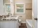 Bathroom with granite countertops, tile accents and wood-look flooring at 1961 S Columbia, Decatur, GA 30032