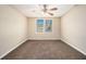 Cozy bedroom with plush carpeting, neutral walls, and a bright window offering a serene and comfortable retreat at 1961 S Columbia, Decatur, GA 30032