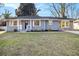 Charming single-story home with stone accents, complemented by a well-maintained lawn and inviting curb appeal at 1961 S Columbia, Decatur, GA 30032