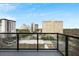 A balcony view showing nearby apartment buildings and skyline at 2425 Peachtree Ne Rd # 903, Atlanta, GA 30305