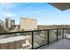 Spacious balcony overlooking the cityscape with modern glass railings for unobstructed views at 2425 Peachtree Ne Rd # 903, Atlanta, GA 30305