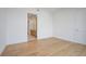Bright bedroom with wood floors leading to a modern bathroom at 2425 Peachtree Ne Rd # 903, Atlanta, GA 30305
