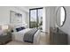 Comfortable bedroom featuring a large window offering city views and cozy bed with plush bedding at 2425 Peachtree Ne Rd # 903, Atlanta, GA 30305