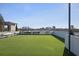 Community dog run featuring artificial turf, benches, and a view of the city skyline in the background at 2425 Peachtree Ne Rd # 903, Atlanta, GA 30305