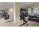 Well-equipped gym featuring weightlifting machines, free weights, and ample workout space with mirrored walls at 2425 Peachtree Ne Rd # 903, Atlanta, GA 30305