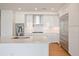A modern kitchen with stainless steel appliances, a gas range, and a large island at 2425 Peachtree Ne Rd # 903, Atlanta, GA 30305
