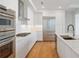 Modern kitchen with stainless steel appliances, white cabinets, and double ovens at 2425 Peachtree Ne Rd # 903, Atlanta, GA 30305