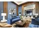 Stylish lounge area with blue sofas, accent chairs, and modern decor at 2425 Peachtree Ne Rd # 903, Atlanta, GA 30305