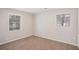 Cozy bedroom with carpet floors and two windows providing plenty of natural light at 3699 Narron Sw Dr, Atlanta, GA 30331