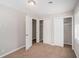 Neutral bedroom featuring carpet floors, closet space, and natural light from the window at 3699 Narron Sw Dr, Atlanta, GA 30331