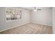 Bright bedroom with neutral walls, carpet flooring, and a window view of greenery at 3699 Narron Sw Dr, Atlanta, GA 30331