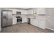 Updated kitchen with stainless steel appliances, white cabinets, and modern countertops at 3699 Narron Sw Dr, Atlanta, GA 30331