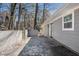 Back of house showcasing a concrete patio, brick wall, and exterior access at 3699 Narron Sw Dr, Atlanta, GA 30331