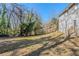 Wide backyard featuring lush greenery, a wooden fence, and part of the home's exterior at 1662 Flintwood Se Dr, Atlanta, GA 30316