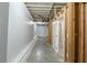 Unfinished basement showcasing concrete floors, white-painted walls, and visible ceiling infrastructure at 1662 Flintwood Se Dr, Atlanta, GA 30316