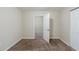 Bedroom showcasing neutral walls, carpeted flooring, and a door that is slightly open in the room at 1662 Flintwood Se Dr, Atlanta, GA 30316