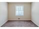Standard bedroom with brown carpet, a single window and neutral colored walls at 1662 Flintwood Se Dr, Atlanta, GA 30316