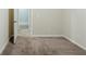 This bedroom features neutral carpet flooring and two doorways at 1662 Flintwood Se Dr, Atlanta, GA 30316