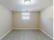 Cozy bedroom featuring new floors, a neutral wall color and a single window at 1662 Flintwood Se Dr, Atlanta, GA 30316