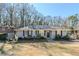 Charming single-story home with a gray exterior, trimmed bushes, and a well-manicured lawn at 1662 Flintwood Se Dr, Atlanta, GA 30316
