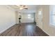 Open-concept living room with wood-look flooring flowing into the adjacent kitchen at 1662 Flintwood Se Dr, Atlanta, GA 30316