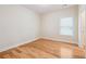 Bedroom with hardwood floors, natural light, and a neutral color palette at 33 Hardpan Aly, Marietta, GA 30066