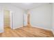 Bedroom with hardwood floors and doors leading to closet and other rooms at 33 Hardpan Aly, Marietta, GA 30066