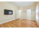 Bedroom with wall-mounted TV and doors leading to closet and other rooms at 33 Hardpan Aly, Marietta, GA 30066