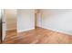 Bright bedroom featuring hardwood floors, a walk-in closet with shelving, and neutral paint at 33 Hardpan Aly, Marietta, GA 30066