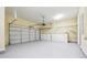 Spacious two-car garage with ample storage, overhead lighting, and a well-maintained epoxy floor at 33 Hardpan Aly, Marietta, GA 30066