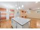 Modern kitchen island, stainless steel appliances, and hardwood floors at 33 Hardpan Aly, Marietta, GA 30066