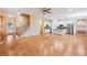 Open-concept living room with staircase, hardwood floors, and modern white kitchen with island at 33 Hardpan Aly, Marietta, GA 30066