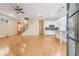 Spacious open-concept living room featuring hardwood floors, staircase, and modern white kitchen at 33 Hardpan Aly, Marietta, GA 30066