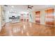 Bright open-concept living room with hardwood floors, modern kitchen, and stylish window treatments at 33 Hardpan Aly, Marietta, GA 30066