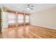 Spacious main bedroom with tray ceiling, hardwood floors, and natural light from large windows at 33 Hardpan Aly, Marietta, GA 30066