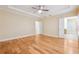 Large main bedroom with hardwood floors and multiple doors at 33 Hardpan Aly, Marietta, GA 30066