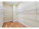 A walk-in closet offering ample storage with wooden floors and wire shelving at 33 Hardpan Aly, Marietta, GA 30066