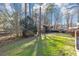 Large grassy backyard with mature trees providing shade and privacy at 4332 N Hickory Ln, Douglasville, GA 30134