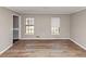 Bright bedroom with wood flooring and natural light from two windows at 4332 N Hickory Ln, Douglasville, GA 30134