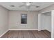 Bedroom featuring a ceiling fan, closet, and wood-look flooring at 4332 N Hickory Ln, Douglasville, GA 30134