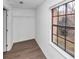 An empty walk-in closet with laminate floors, a window, and a wire shelf for storage at 4332 N Hickory Ln, Douglasville, GA 30134