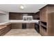 Kitchen with ample cabinet space, tile countertops, and stainless steel appliances at 4332 N Hickory Ln, Douglasville, GA 30134