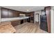 A kitchen features ample cabinet space, tile countertops, and stainless steel appliances at 4332 N Hickory Ln, Douglasville, GA 30134