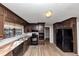 Bright kitchen with ample cabinet space, tile countertops, and stainless steel appliances at 4332 N Hickory Ln, Douglasville, GA 30134