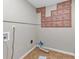Laundry room with tile flooring, washer hookups, and stone textured decor at 4332 N Hickory Ln, Douglasville, GA 30134